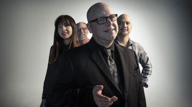 Studio shot of the Pixies members, Black Francis in the centre, David Lovering, Joey Santiago and new bassist Paz Lenchatin