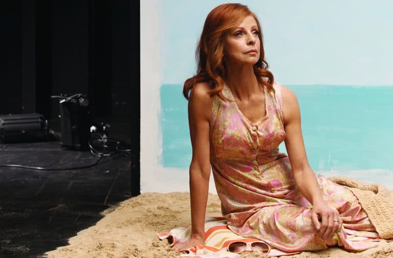 Heather Mitchell as Gwen in STC's production Away, poses on beach set