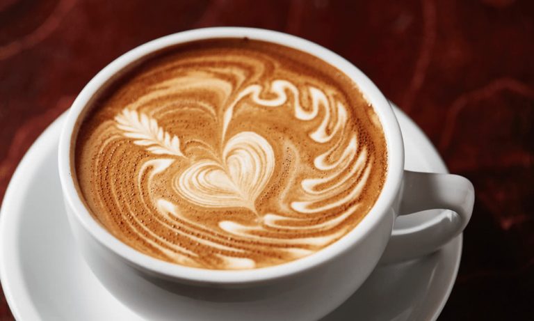 A flat white with a heart in the foam