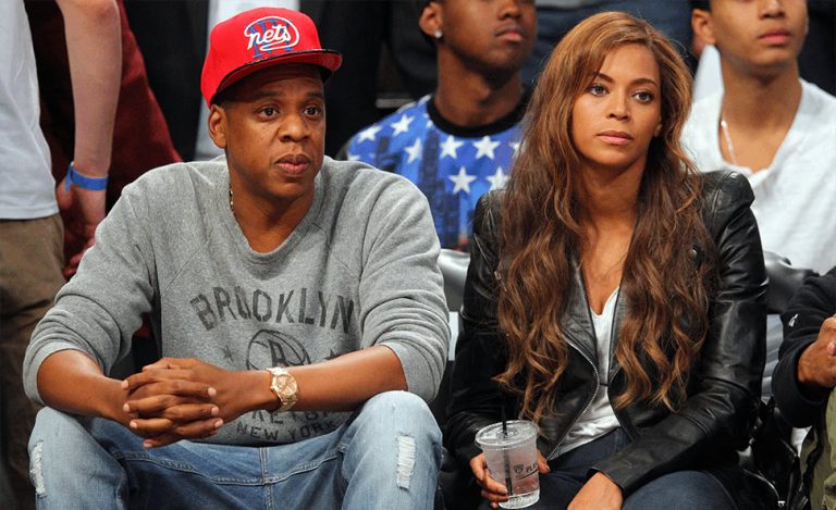 Shawn 'Jay-Z' Carter & Beyoncé watching a basketball game
