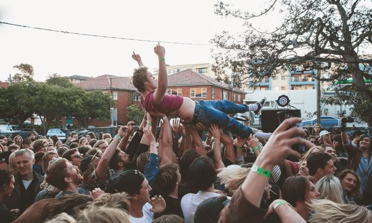 A man crowdsurfing at Sounds of the Suburbs festival