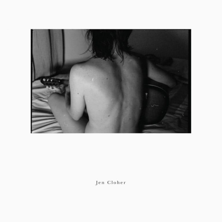The cover of Jen Cloher's self-titled album, featuring Cloher naked facing away from the camera, sitting on a bed playing guitar.
