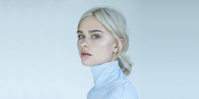 Nicole Millar press shot 2017 blonde with blue top
