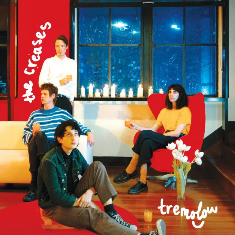 The cover of Tremolow, The Creases' debut album, in which the band members sit disaffectedly in a red loungeroom with lilies.