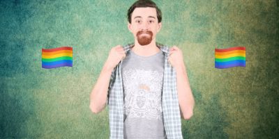 David Molloy displays his 'Not Margaret Court' Sigur Rós t-shirt flanked by rainbow flags