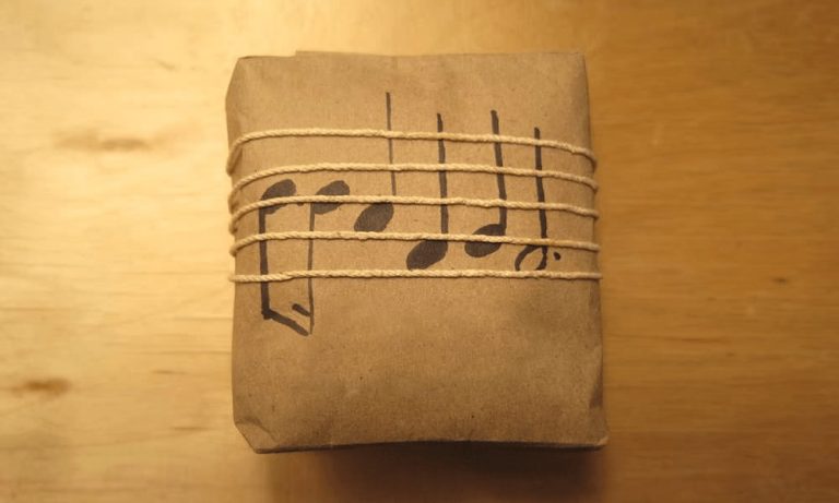 A gift wrapped in music-themed paper