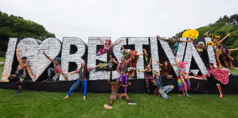 Fans gather around a sign that reads 'I Love Bestival'