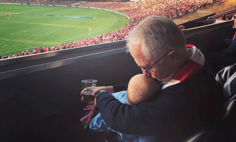 Facebook image of Malcolm Turnbull and his granddaughter Alice watching the football