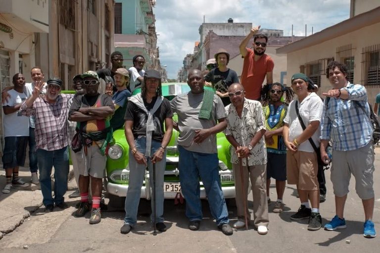 The members of Havana Meets Kingston in front of a car