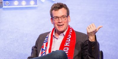 John Green in a scarf at a convention