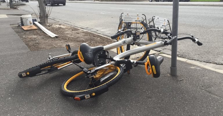 Image showing an oBike strewn along a footpath