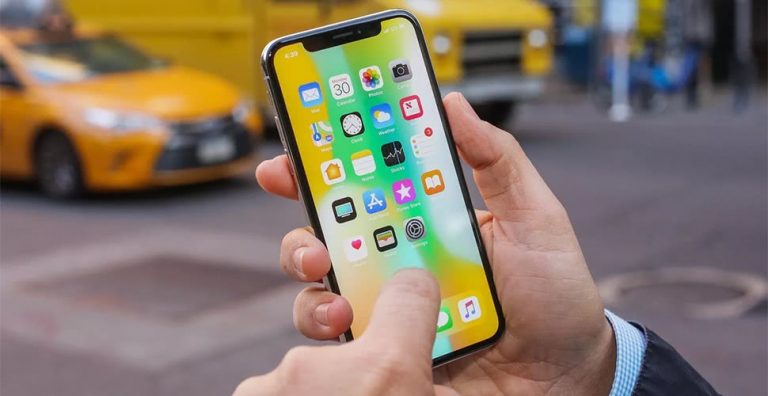 Image of a person using an Apple iPhone X