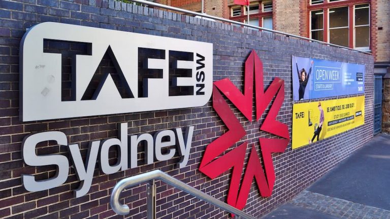tafe nsw building sign in sydney on brick wall