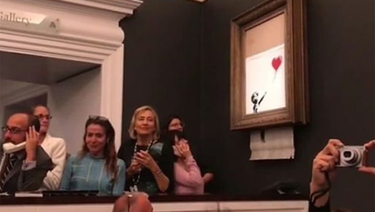 Image of Banksy's 'Girl With Balloon' being shredded
