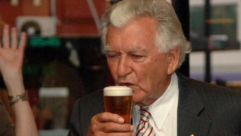 Photo of Bob Hawke drinking a beer