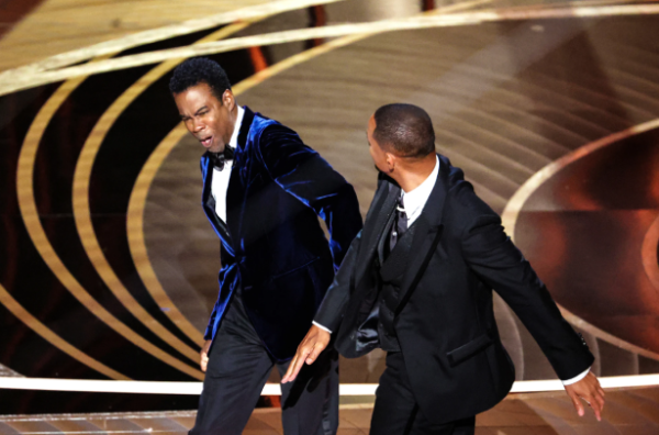Chris Rock's brother definitely isn't forgiving Will Smith anytime soon