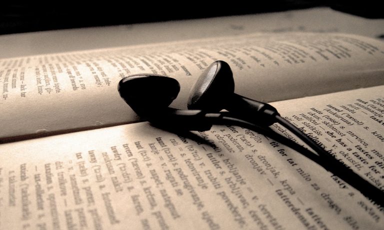 study Headphones rest on an open book