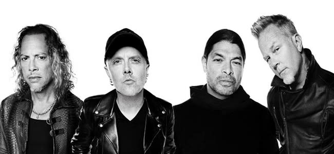 Metallica band members wearing black clothes standing in front of a white background