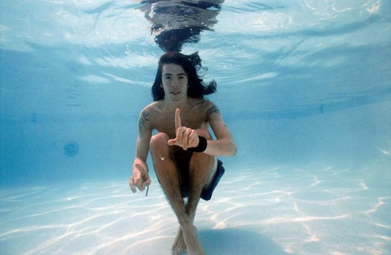 Dave Grohl under water pointing his finger up