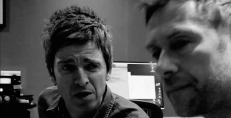 Black and white image Noel Gallagher and Damon Albarn close up to camera