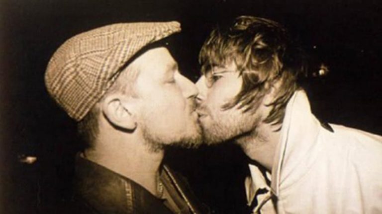 Bono and Liam Gallagher kissing in 1996