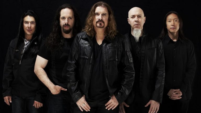 The five members of US rock group Dream Theater standing in a line