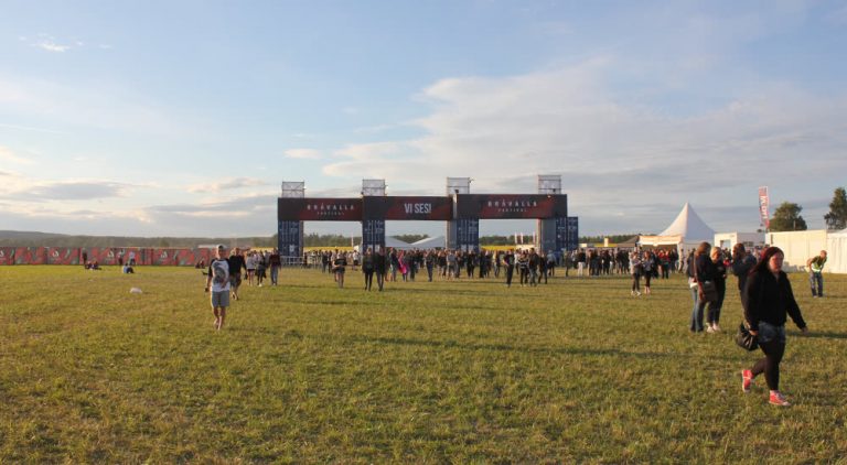 An empty field and festival gate