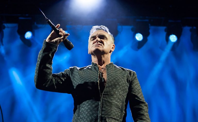 Morrissey onstage looking angry