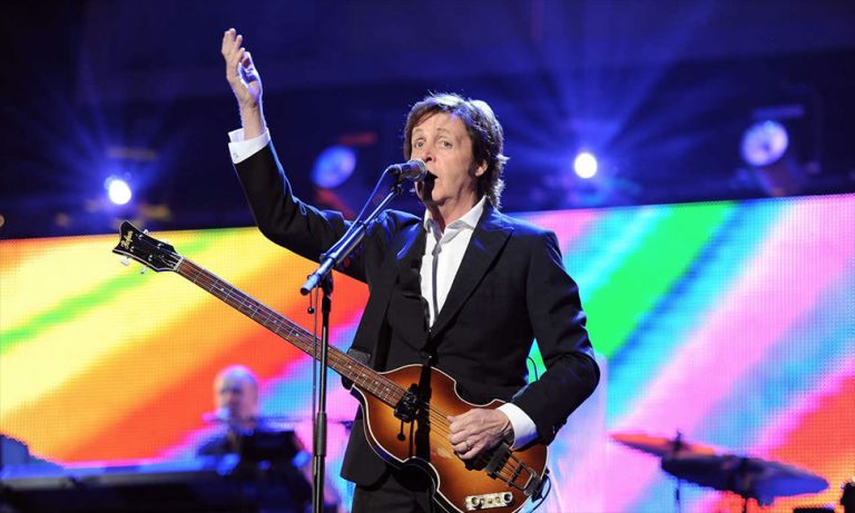 Paul McCartney performing live on stage