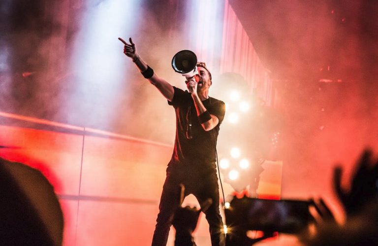 Rise Against frontman onstage with a megaphone