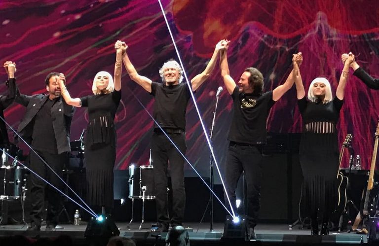 Roger Waters and Eddie vedder bow onstage