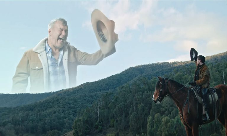 Jimmy Barnes appears as a cowboy floating in the sky