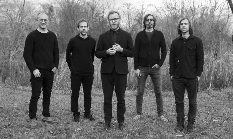 Members of US rock band The National in a forest.