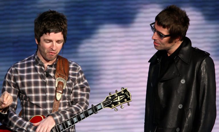 Liam and Noel Gallagher onstage