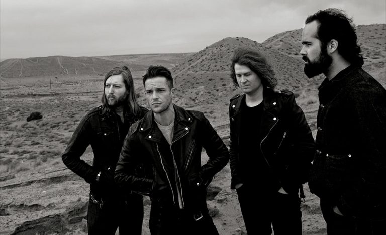 Black and white image of US rock band The Killers in a desert
