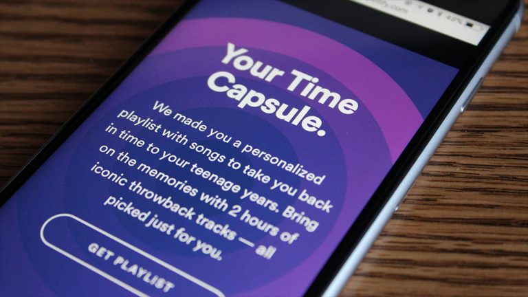 Image of a phone using Spotify and its 'Time Capsule' service