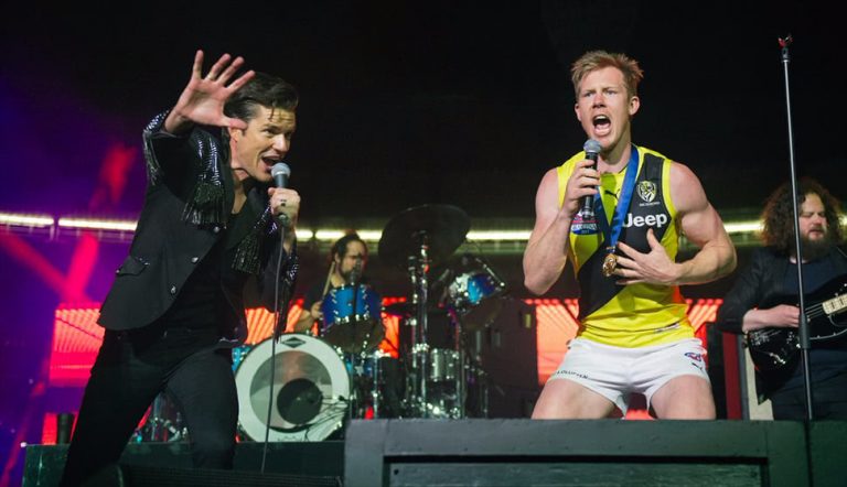The Killers performing with Jack Riewoldt at yesterday's AFL Grand Final