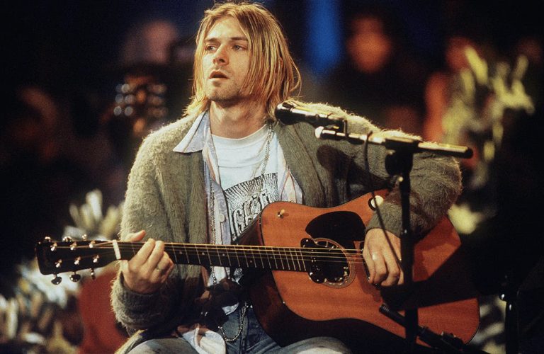 Kurt Cobain of Nirvana playing acoustic guitar