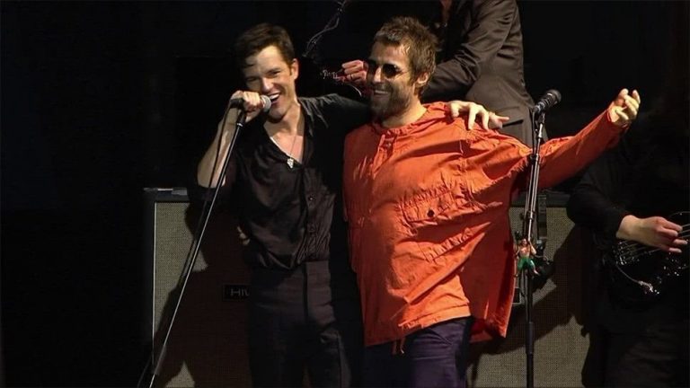 Liam Gallagher appearing onstage with The Killers at Lollapalooza in Brazil