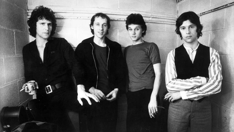 English rock band Dire Straits pictured in the '80s, with frontman Mark Knopfler, second from the left.