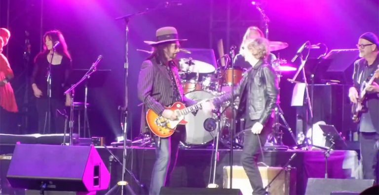 Mike Campbell of The Heartbreakers performing live alongside Beck