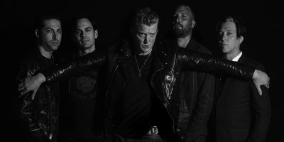 Promotional image of rock’n’roll legends Queens Of The Stone Age (QOTSA)
