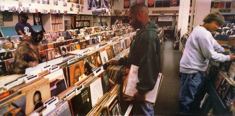 The artwork from DJ Shadow's debut album 'Endtroducing...', depicting some music lovers digging through vinyl.