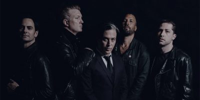 Promotional image of rock’n’roll legends Queens Of The Stone Age