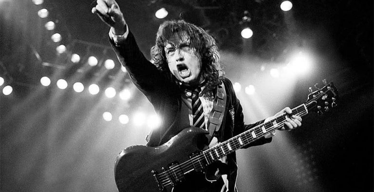 Angus Young of AC/DC playing guitar