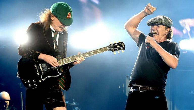AC/DC's Angus Young and Brian Johnson performing live.
