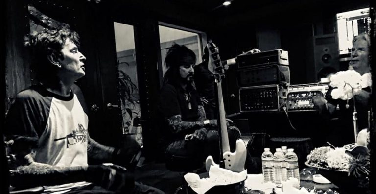 Members of Mötley Crüe in thr studio with producer Bob Rock