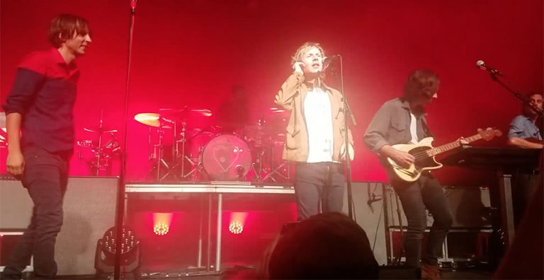 Image of Beck onstage with French rockers Phoenix