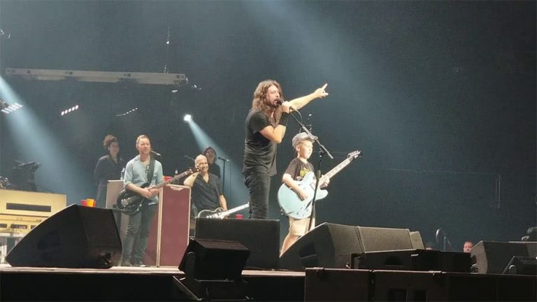 Foo Fighters' Dave Grohl onstage with a ten-year-old fan