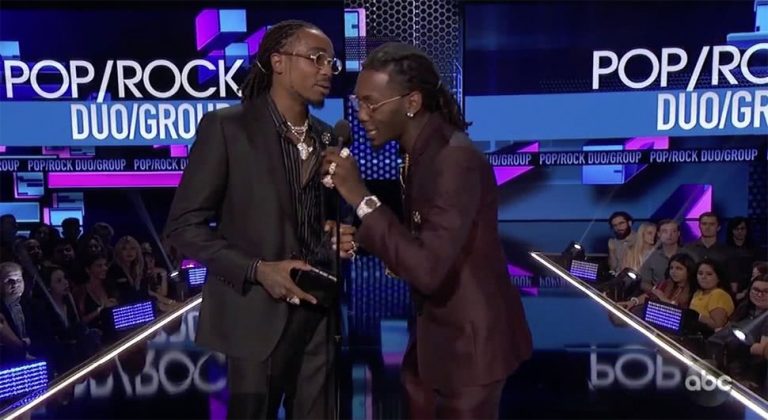 Members of Migos accepting their AMA Award